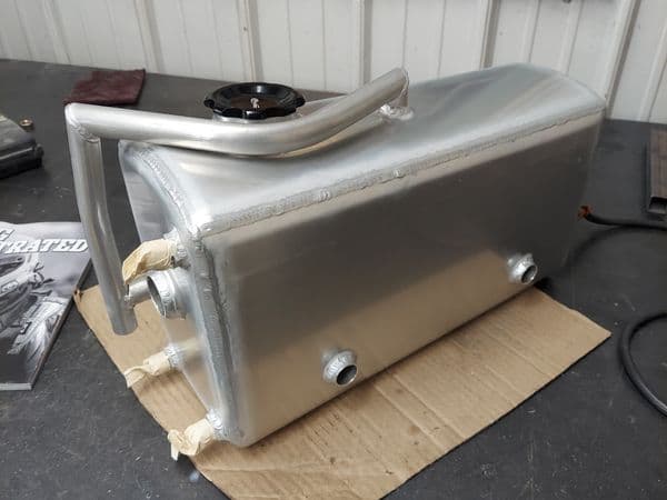 Aluminum tank with precision welded fittings